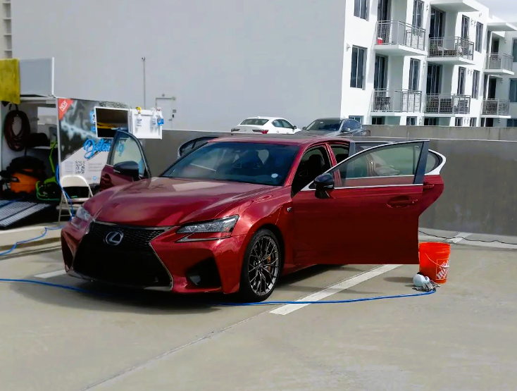 Red Lexus road in a car wash set for a road trip @iconcarusa Instagram
