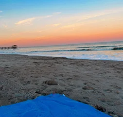 A picnic mat on the Cocoa Beach - @karinachismar Instagram