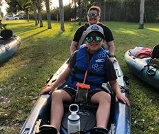 A woman and her son about to kayak at the Cocoa Beach - @zoegray42 Instagram